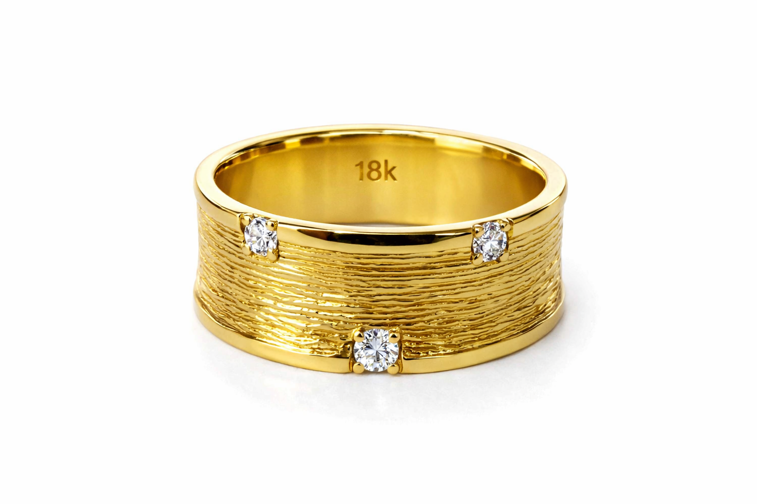 Gold ring with diamond accents on a white background