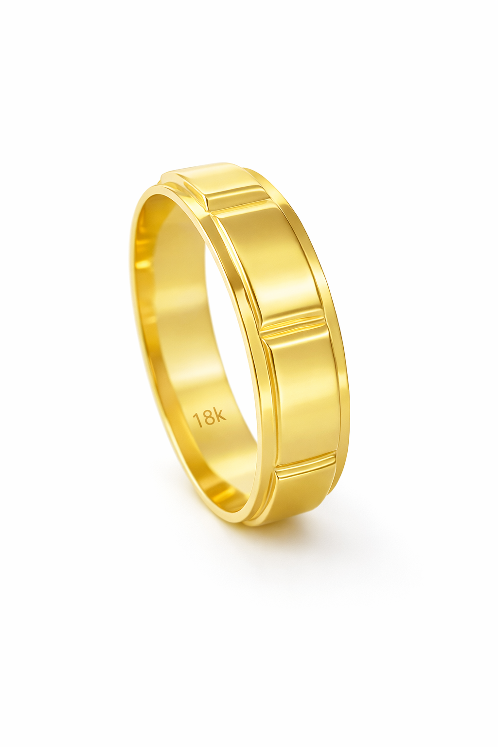 Gold ring with '18K' marking on a white background