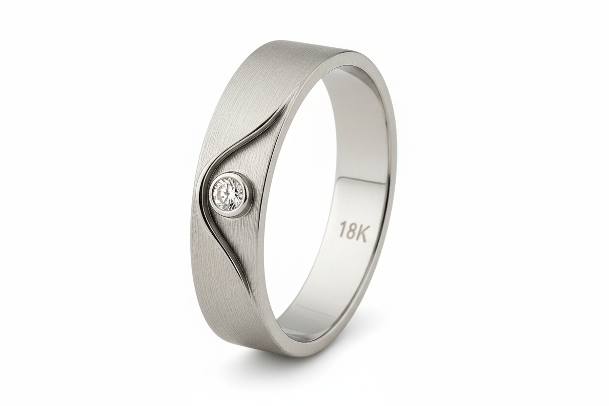 Gold ring with a diamond on a white background